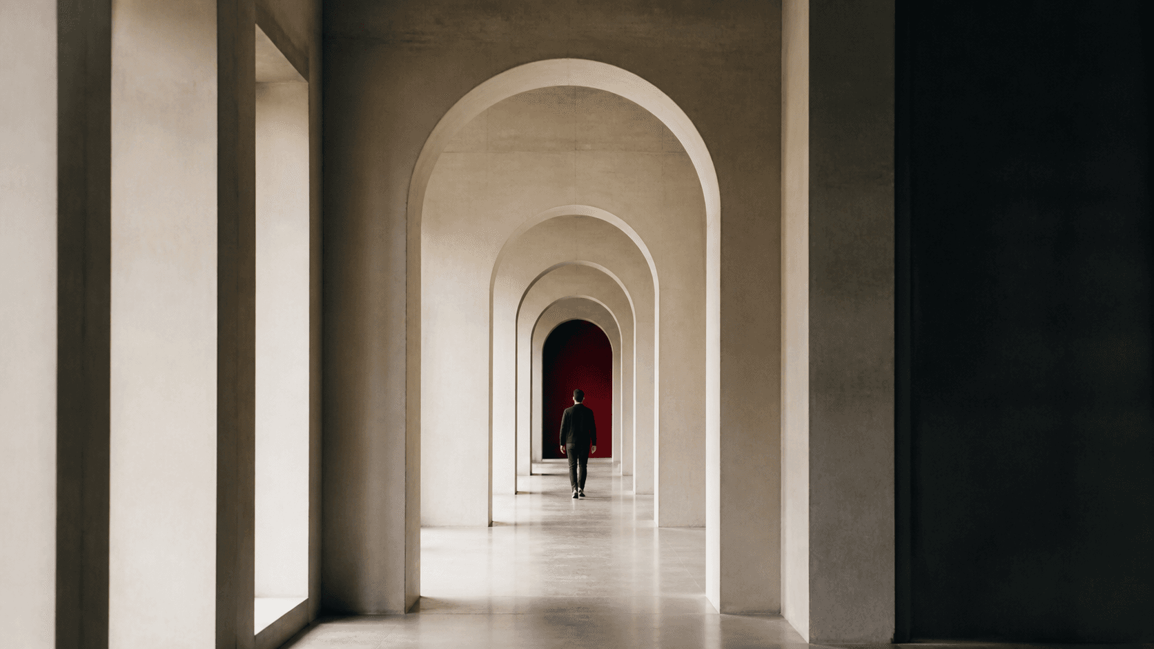 A sequence of arches leading forward